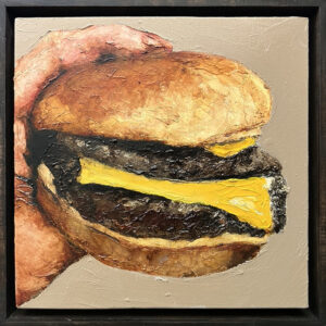 Double Cheeseburger in Hand